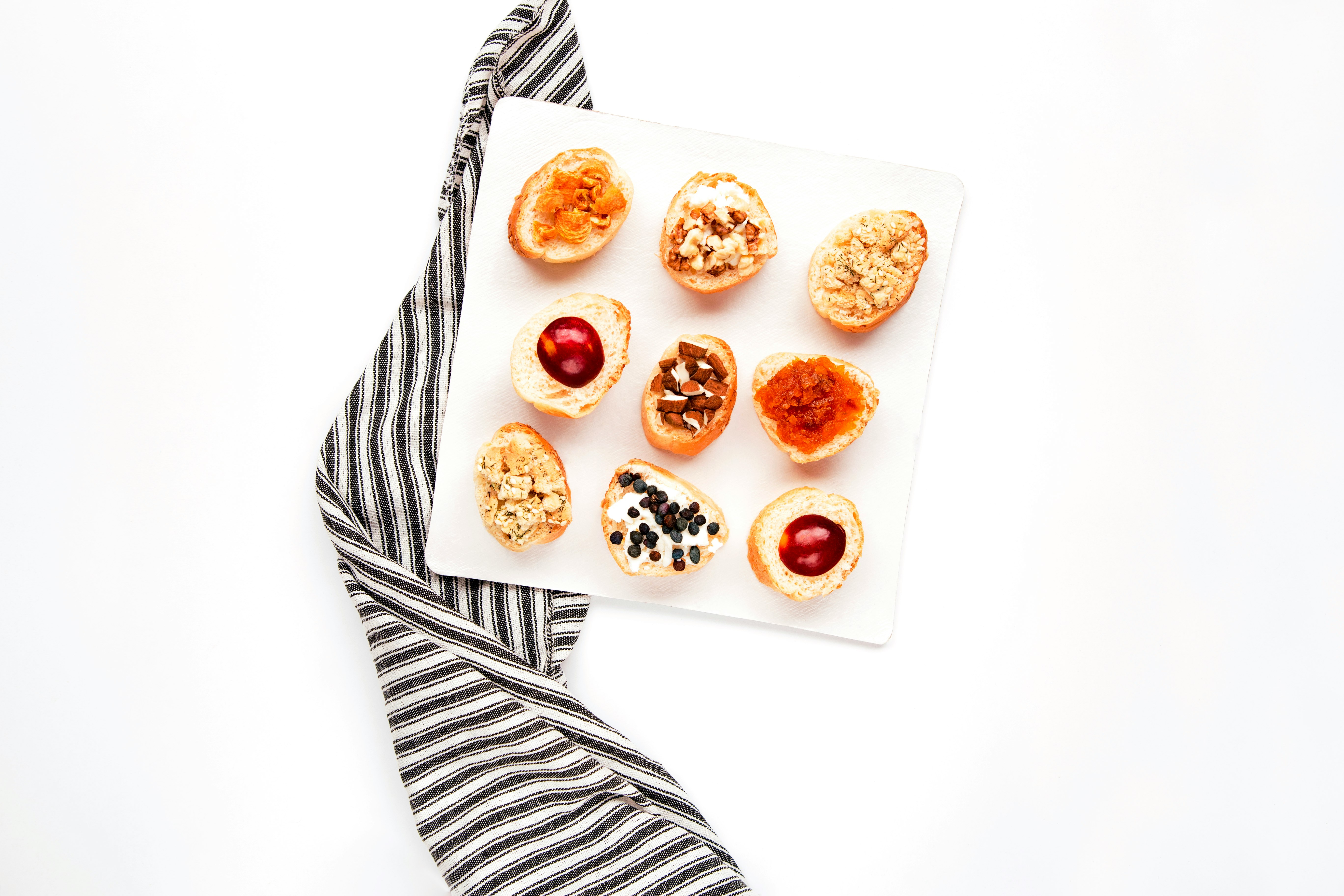 brown and white doughnuts on white ceramic plate